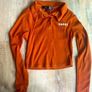 This is a slim fitting top with a vibrant orange